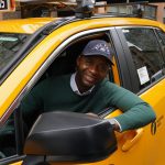Real iOttie customer Mohamed behind the wheel of his NYC taxi cab
